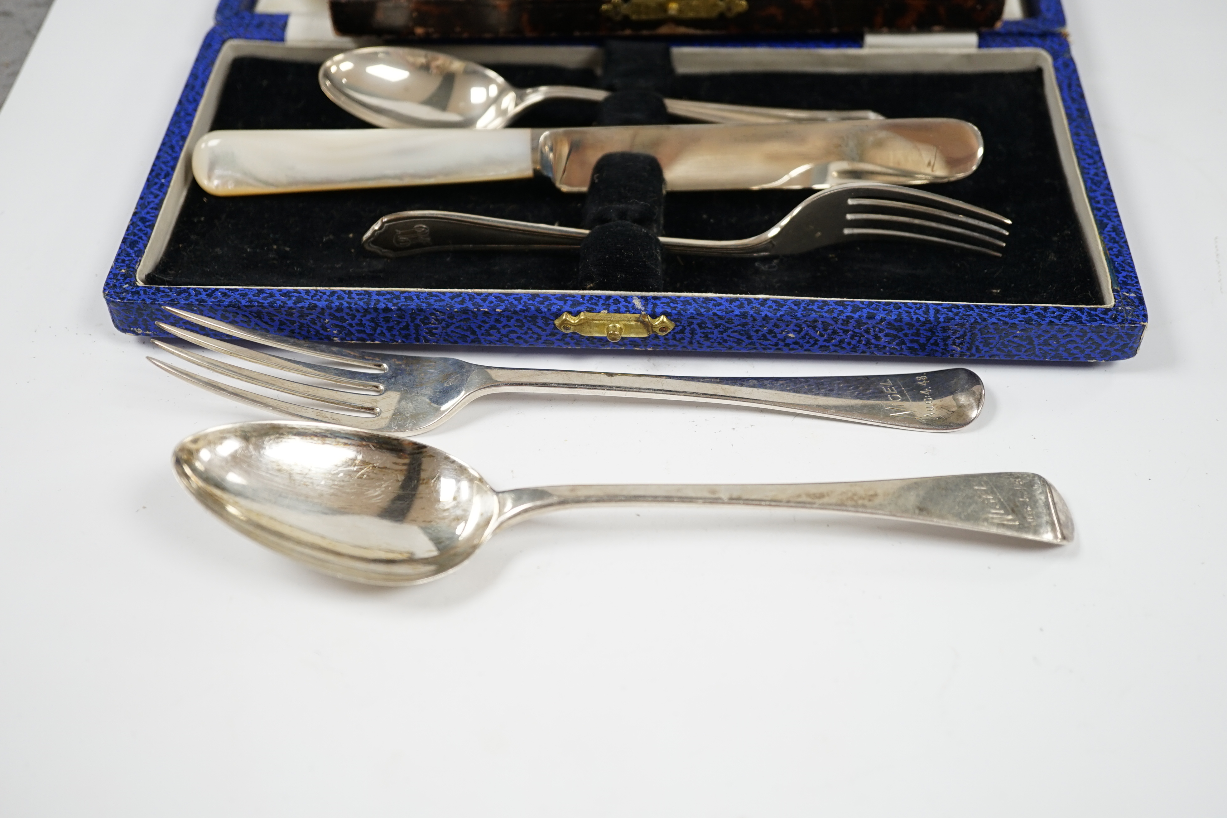 A George VI cased silver christening trio, Sheffield, 1946/7, a matched silver christening pair and a cased set of six silver pastry forks. Condition - fair to good